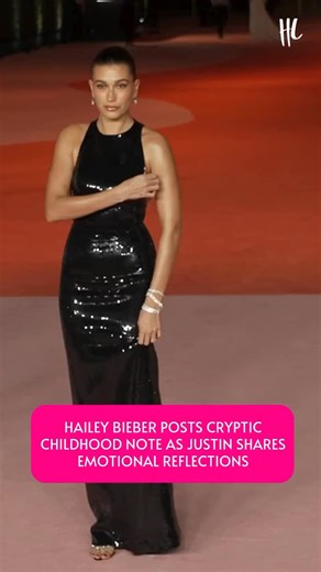 Hailey Bieber gave fans a glimpse into her past and current mindset by posting a childhood notebook message that read, “Cry me a river, build me a bridge and get over it,” calling it “Relevant!” She also shared a picture of a composition book signed with her maiden name, Baldwin. The post comes amid a wave of cryptic and vulnerable messages from husband Justin Bieber, who has opened up on Instagram about feeling unworthy and struggling to accept love. Despite the emotional tone, the couple recen
