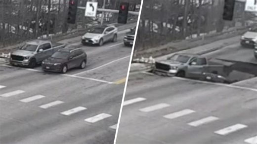 Watch: Sinkhole swallows vehicles at traffic light in Omaha