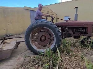 Farmall H and Servis stalk cutter shredding milo & corn stalks
