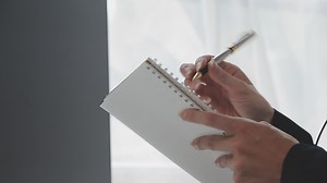 Download Young customer service representative wearing headset in office for free