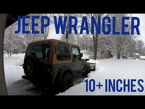 Jeep Wrangler Sahara plowing deep snow