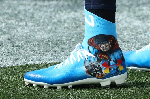 Cam Newton salutes Chadwick Boseman, Black Panther on his pregame cleats