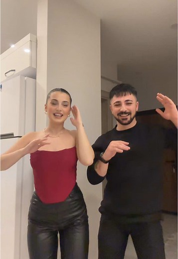 Dynamic Dance Routine in a Modern Kitchen