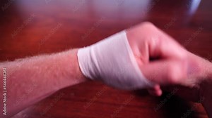 bandaging an arm from a snake bite