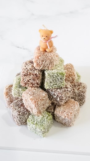 First time making a Lamington Cake — soft sponge with raspberry jam,...