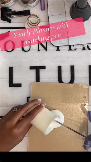 Vanessa Davis • Vmd Designs on Instagram: "Almost time to get your new planner for 2026! Make your own cover and pen using my tutorial! Full tutorial is available on my YouTube Channel! Link is in the comments!👇🏾 #glitter #fblifestyle #YearlyPlanner #planner #tutorial #epoxy #resinart #fyp #resin"