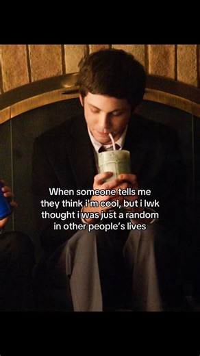 @auntvoid on Instagram: "🥤 Interesting fact: This meme exposes the glitch in the "NPC" mindset. It features Logan Lerman looking shy and reserved, quietly sipping a milkshake. The text describes the genuine shock of finding out someone admires you when you were convinced you were just background decoration in their life. It hits because of the disconnect between self-perception and reality. We often assume we are invisible "randoms." Hearing that you have an actual reputation and a "cool" one a