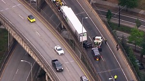 Driver jumps out before car crushed between semi and SUV on Marquam Bridge