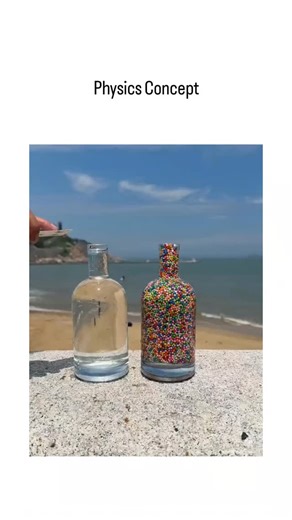 👁️ on Instagram: "The X post features a 48-second video filmed on a sunny beach, where a hand pours clear water from a glass into an upright plastic bottle pre-filled with colorful small plastic beads, causing the beads to swirl and lift upward in swirling patterns due to turbulence and buoyancy forces. This demonstrates basic fluid dynamics and Archimedes' principle, as the less dense beads experience an upward buoyant force exceeding their weight when displaced by the incoming water stream, a