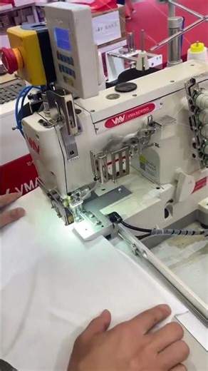 Semi automatic interlock for cuff hemming of T-shirt