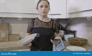 Angry Woman Smashing Plate in Kitchen Stock Footage - Video of person, standing: 197812134