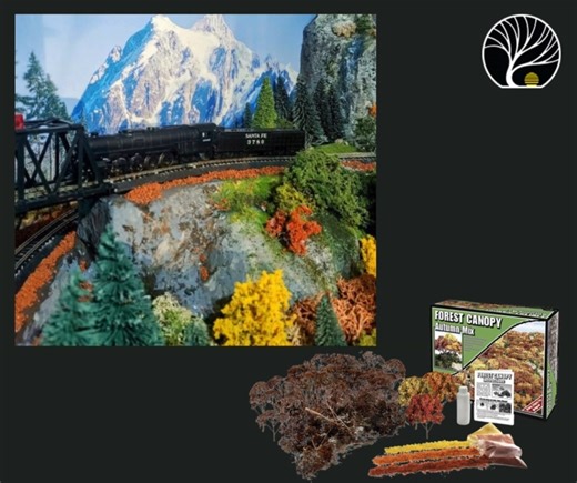 🚂✨ A powerful Santa Fe locomotive winds its way across a high bridge, with rugged cliffs and autumn colors below and snowcapped peaks towering in the distance. It’s the kind of scenery that makes model railroading feel larger than life. With Woodland Scenics, you can capture every detail—towering mountains, rocky cliffs, vibrant foliage, and the drama of a train pushing through it all. 📷 Larry Foster #WoodlandScenics #ModelRailroad #MountainScenery #TrainScenery #FallLayouts | Woodland Scenics