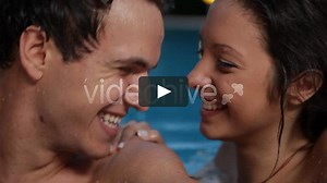 Couple Kiss In Swimming Pool