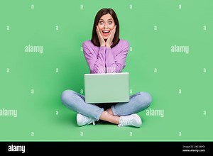 Full size photo of young adorable pretty cute woman touch cheeks open mouth crazy tiktok trendy video popular isolated on green color background Stock Photo - Alamy