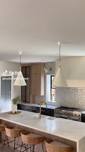 Taking you on a tour from every angle of this beautiful kitchen! 🖤 the stunning combo of black cabinets and white oak, iron doors, a statement backsplash, waterfall island, floating vent hood wrap, make this space truly standout! ✨ a design fusion we love to admire. 👩🏻‍🎨 What's your favorite design element in this kitchen? 👇🏻 Share your thoughts!. #luxuryhomes #kitchenhighlight #2024trends #kitchenremodel #customkitchen #kitchendesign #designs #fypシ #kitchenhacks