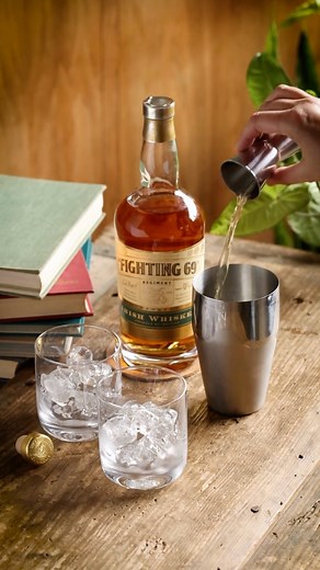 A cocktail made for golden hour. Enjoy Fighting 69th Irish Whiskey in our signature cocktail for a smooth, refreshing pour to wind down the work day. Gold Rush 2 oz. Fighting 69th Irish Whiskey 2 oz. fresh lemon juice 2 oz. honey ginger syrup Lemon wedge, garnish Luxardo cherry, garnish Honey Ginger Syrup 4 oz. honey 4 oz. water 2 oz. peeled and grated ginger Bring honey, water, and ginger to a boil over medium heat and stir constantly for 10 minutes. Turn heat off and let steep for 20 minutes. 