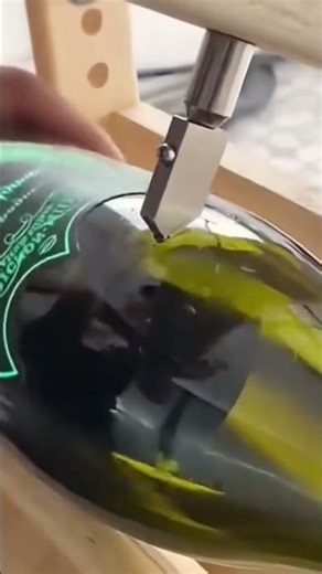 The following is the process of cutting a glass bottle using a homemade cutting tool.