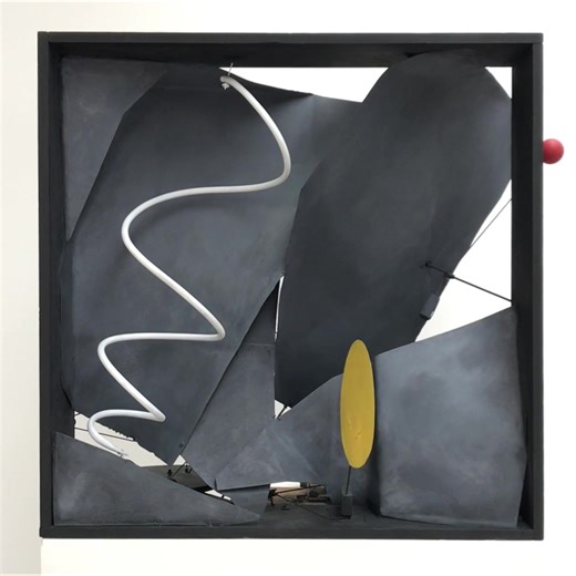Black Frame is a celebrated example from a series of motorized “frames” and “panels”—or three-dimensional paintings—that Calder developed in Paris in 1931 and continued to explore in Roxbury in the mid-1930s. He described the motorized mobile in a September 1935 letter to collector A. E. Gallatin: “One I like very much myself is a black wooden frame, with sheets of metal within it, warped into various planes, and having certain moving elements, which are brilliant spots in an otherwise somber se