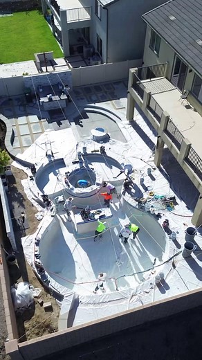 From concept to reality, this guitar-shaped pool hits all the right notes! Watch the transformation take flight with our drone view and see how every curve and detail comes together for a backyard that truly rocks 🎸 Custom designs, made your way. Ready to build your own unique pool? Call or DM today for a free quote. | Majestic Pool Construction