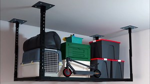 Heavy-Duty Overhead Garage Storage Rack with Reinforced Base Plate - 1100LB Capacity, 24x47x31 Inch Foldable Steel Shelf, 15"-31" Height Adjustable for Concrete Ceilings (Black, Secure Storage)