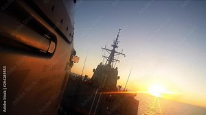 seahawk helicopter final approach for landing on Navy destroyer.