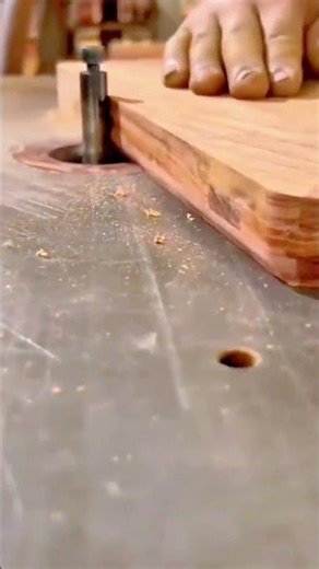 shaping edges of a thick wood board using a stationary router machine for a smooth profile finish