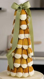2.2K views · 23 reactions | This Christmas-themed madeleine tower is a total showstopper and easier to make than you might think! Our simple melt-and-mix recipe for madeleines uses McKenzie's baking powder for lift, and creates tender, buttery little cakes, delicately perfumed with sweet festive spices. There will be a few extra madeleines leftover from assembling the tree so serve these separately or they can be the ‘baker’s treats’! #sponsored | Women's Weekly Food | Facebook