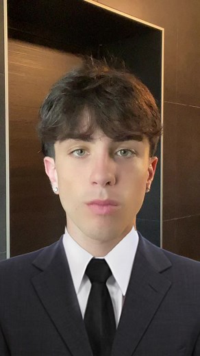 Stylish Black Suit with Eye-Catching Tattoos