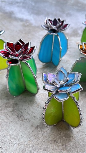 Making a Sky blue & green irid stained glass cactus . #stainedglassart #glassflower #cactus #houseplants #weddinggift #weddingdecor #succulents #tropicalflowers #stainedglassartist #stainedglassflower #stainedglasscactus #tabledecor #everlastingflowers #soldering | Aura Terrariums