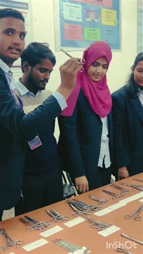 Students identifying & naming surgical instruments during a practical session.