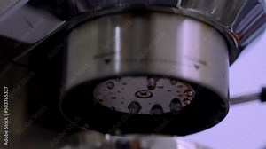 footage of an esspresso machine performing automatic descaling