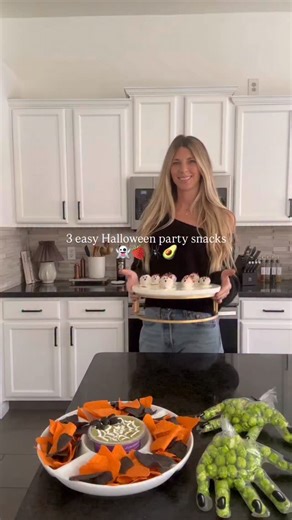 All of these Halloween party snacks took just minutes to create! 🕸️🕷️First, I used store-bought guacamole dip and made a spiderweb design with sour cream and a toothpick. I made a quick black olive spider and then surrounded it with orange and black tortilla chips. 👻🍓Next, I did strawberries dipped and melted white chocolate and used black gel icing for the eyes and mouth. *Make sure you freeze them strawberries for a few minutes in between dipping in chocolate and drawing the face on them. 