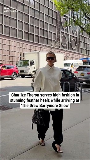 Charlize Theron serves high fashion in feather heels while arriving at 'The Drew Barrymore Show'
