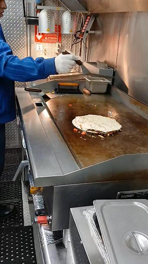 Indulge in a steak pizza at Garcia's Hot Dogs, available for $11.99. Come and get it. | Abacuc Garcia