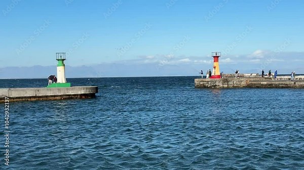 The eastern harbour walls and entrance to the well known Kalk Bay fishing harbour near Cape Town. Kalk Bay is located on the False. Au coastline in the Deep South of the Cape Peninsula.