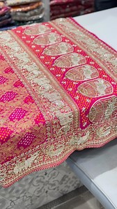It's a piece of art. Bandhej x Zardosi. This saree has a story. Handwoven in the holy city of Varanasi, it takes six months to make one of these. Once weaved it travels to kutch for the intricate rai bandhej. Hand dyed by master dyers, the bright colour makes it special. We then do the intricate solid Zardosi Embroidery with elephants and peacocks highlighted. Fall in love with this piece of luxury fashion. #Saree #Sarees #SareesUSA #SareeUSA #SareeLove #SareeLovers #Handloom #Bandhej #BandhejSa