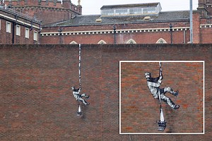 New art of prisoner escaping on side of former jail IS a Banksy