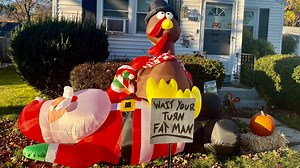 'Wait your turn fat man': Dueling decorations in Rhode Island help to lift spirits