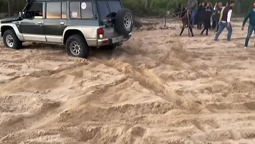 Rescuing a Stuck SUV in Sandy Terrain