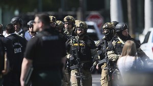 A sniper killed a Florida bank robber as he held a knife to a hostage's throat