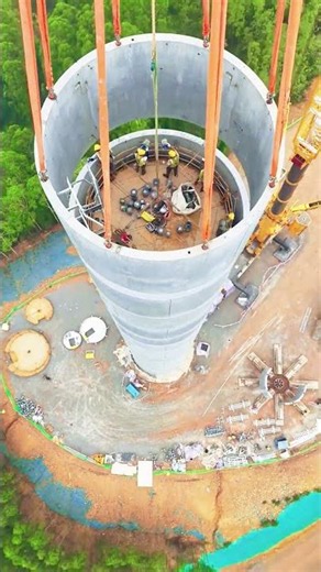 Concrete Wind Turbine Tower Being Stacked in Sections