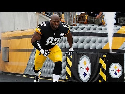 James Harrison does push-ups with Maurkice Pouncey on his back