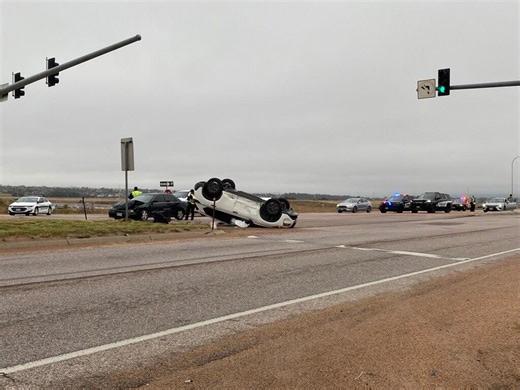 Driver running red light causes rollover at busy Colorado Springs intersection