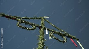 Maypole in Swedish midsummer under blue sky, Stockholm, Sweden Stock Video