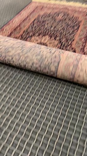 Mechanical rug duster removes years of dirt out from this rug! #cleaning #rug #professional | Clean That Up