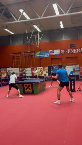 Intense Table Tennis Doubles Match in Action