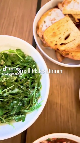 Small Plates Dinner Toasted bread topped simply. Greens cut with citrus. Shrimp served cold with bite. Scallops kissed by butter in a hot pan. Finished with the right glass beside it. The complete menu with recipes, timing, and pairing notes is on Substack. Subscribe to make it yourself. Link in bio. . . . #smallplates #dinnerfortwo #homecookingideas #cookingtogether #foodinspiration
