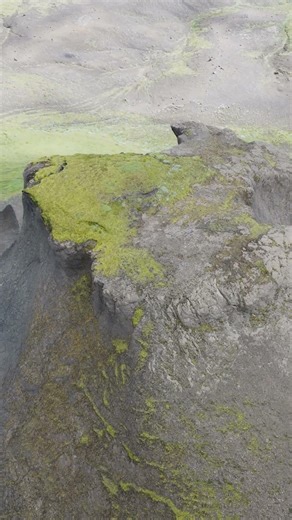 Flying Along a Volcanic Cliff in Iceland