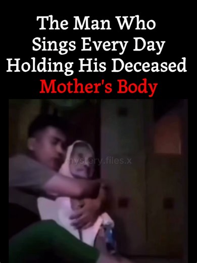 What started as a bizarre social media trend turned into one of the most disturbing mysteries on the internet. A young man began posting videos of himself singing calmly while staring into the camera, but it was the figures in his arms that sent shivers down the world's spine. It was later revealed that the two motionless individuals were his deceased parents. 📍 The Haunting Repetition • The Routine: Every single day, he posted a new video on TikTok using the same song and the same angle. • The