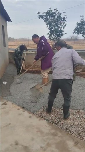 Hardworking Crew Levels Concrete for a New Outdoor Space